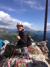 Jo Taylor tied to the cross at the top of the South Arete, Sass de Stria/ Hexenstein