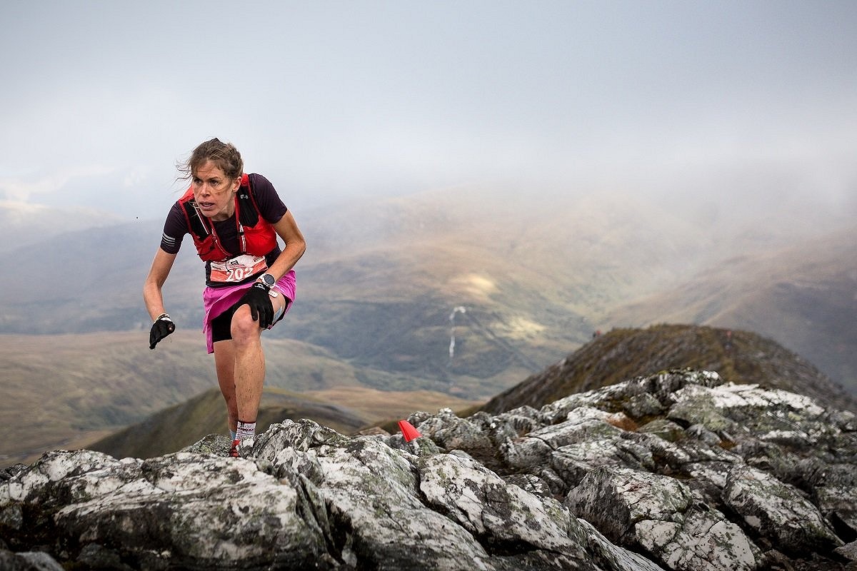 In skyrunning races, red flags mark the route (pictured here - Spanish runner Laura Orgue on the Mamores VK)  © Skyline Scotland