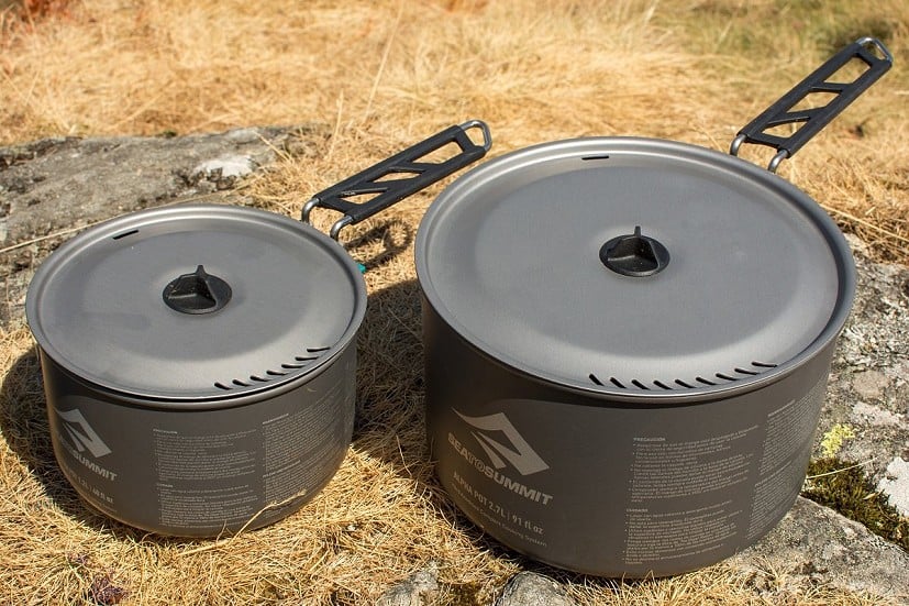 With strainer lids and folding handles, the 2.7l and 1.2l pans are good pair for 2-person camp cooking  © Richard Prideaux