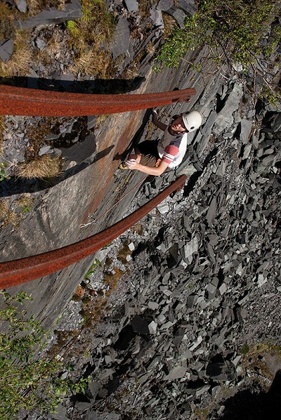 James Oswald eyeing up the finishing hold on Off The Beaten Track (E3 5c) on the aptly named Railtrack Slab.  © Mark Reeves