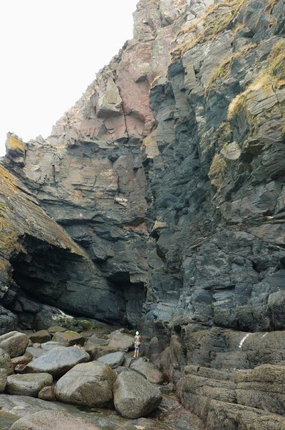 Scoping the route with the offwidth/squeeze chimney seen high up.  © Stu Bradbury