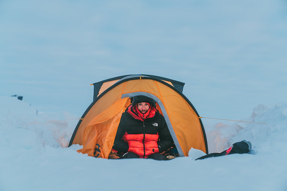 Alex Honnold seeks refuge in his tent.  © The North Face