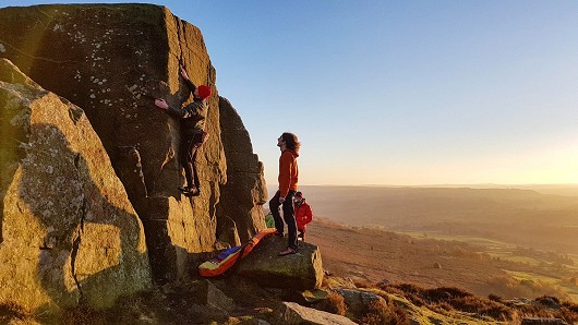 Sneaking in a quick sunset boulder at Curbar. Rory being spotted by Sam and his massive shadow.  © Dawn_K_B