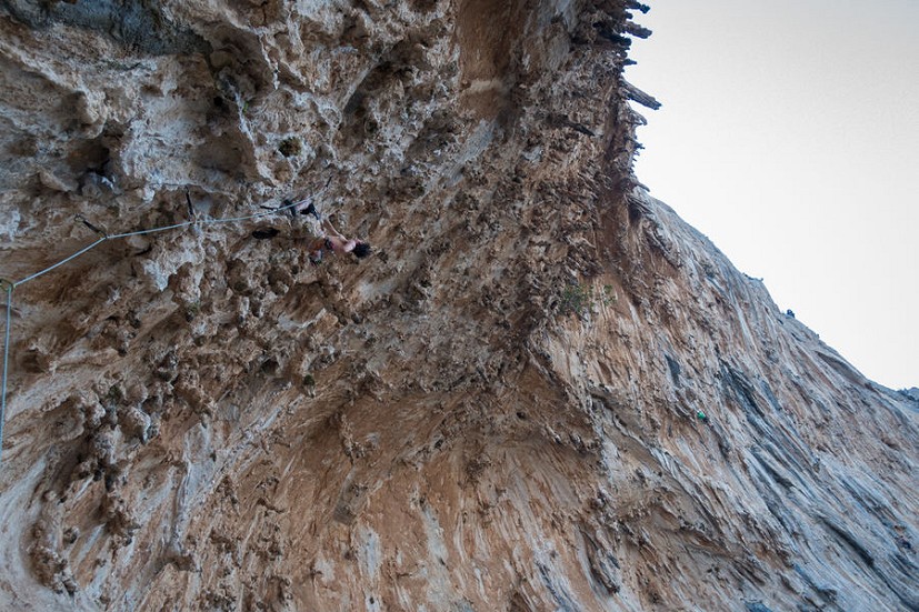 The author a short way up Priapos (7c) in the Grande Grotto, Kalymnos  © Penny Orr