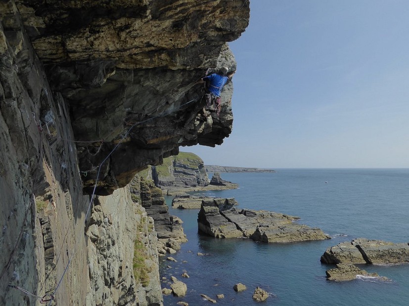 Gogarth must surely feature in any applicant's trad logbook. Andy Wilson pulling hard but not too hard on the extreme shufflefest of Hanging out at Glastonbury, Castell Helen.  © Misha Nepogodiev