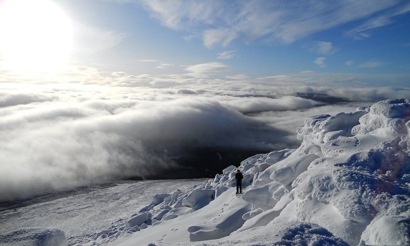 Summit of Ben Rinnes in winter looking down on the clouds  © AndrewHeaton