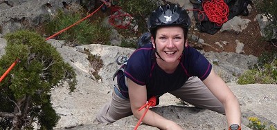 Elaine smiling her way to the top of a classic route in Sella, Costa Blanca.  © Sally Lisle