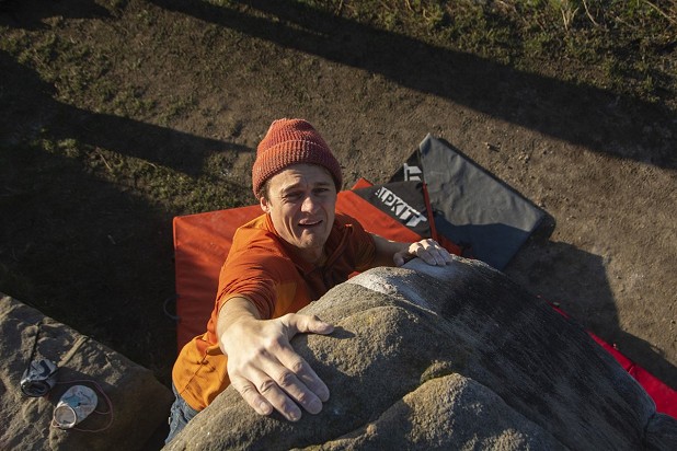 Rob Greenwood slapping for the top of Trackside in the Curbar Filed boulders  © Alan James