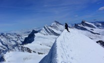 Straddling a snowy SE ridge on Monch