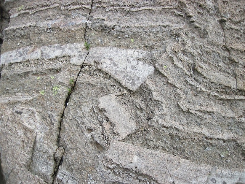Layers of ash + pumice (volcanic froth) in the Borrowdale Volcanics. Layers are deformed by ground vibrations during eruptions.  © UKC Articles
