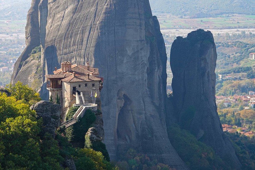 Roussanou Monastery with Pillar of Dreams 5c+ behind.  © Chris Craggs