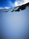 Beautiful snow slope below summit of Binnien Mor