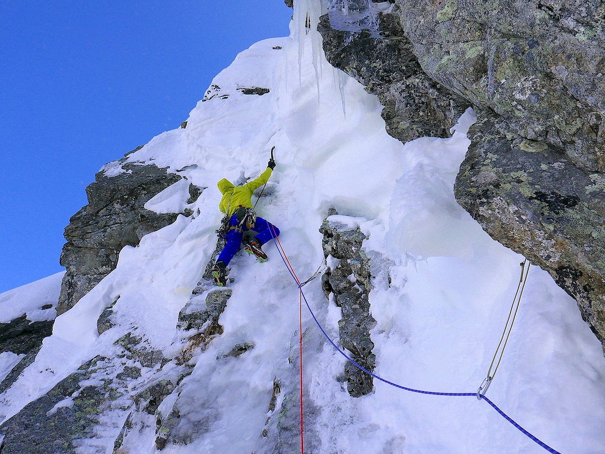 Matt on the final pitch pulling steep moves on some funky unconsolidated snow ice.   © Jon Bracey