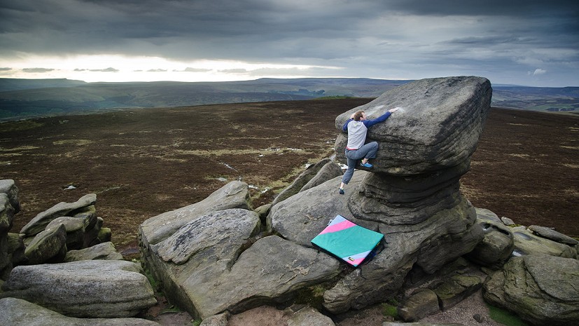 Ned Feehally grappling with slopers at Back Tor in the Peak District  © Nick Brown - UKC