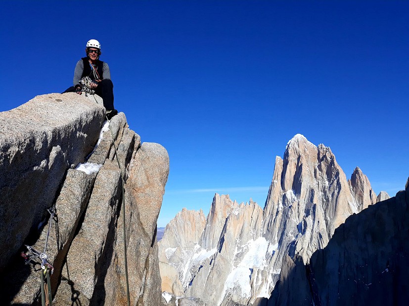 Pete Graham on the summit of Tito Carrasco, the North and Northwest aspects of Fitzroy visible behind.  © Ben Silvestre
