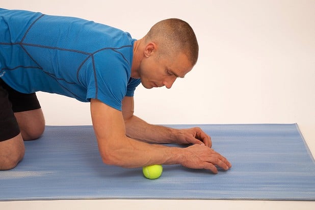 Tennis ball massage is a great supportive practice for reducing muscle tension in the forearms. Treat yourself after climbing or on rest days. Photo: Steve Gorton  © Steve Gorton