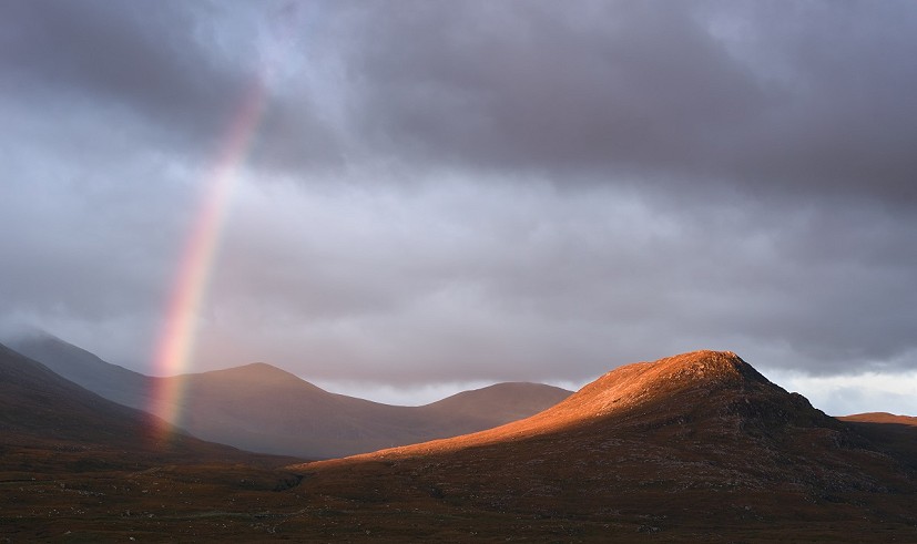 Rainbow over the Fannaichs. The best light may only last a few seconds -  make sure you're ready for it  © James Roddie