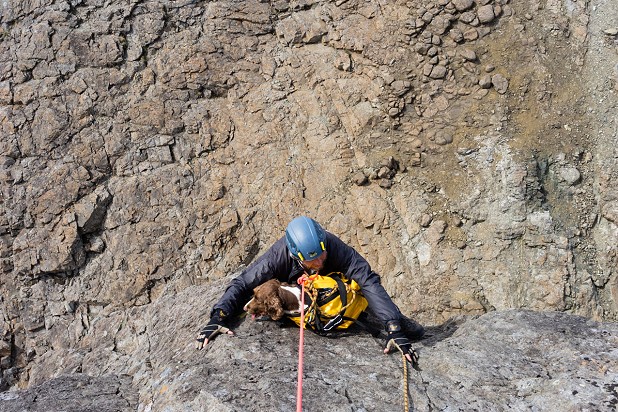 Mac scrambling up from ledges below the abseil anchor  © Adrian Trendall