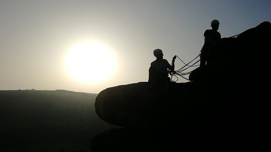Dan and Matt finishing the Hawk's Nest Crack at the end of the day at Froggatt Edge, Peak District.  © AquilasTalon