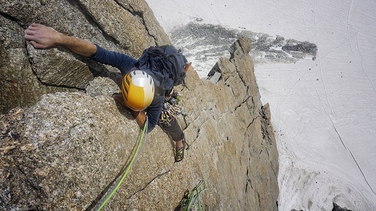 Aled reaching the finishing jug on the crux pitch on the Contamine Route.  © JohnHartley