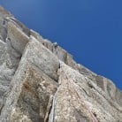 Leading the crux overhang of the Rebuffat-Pierre, Aiguille du Midi (TD-, 6a+).