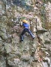 Owain Hassall on the first ascent (seconding) Owain Glyndŵr, VD at Bailey Quarry