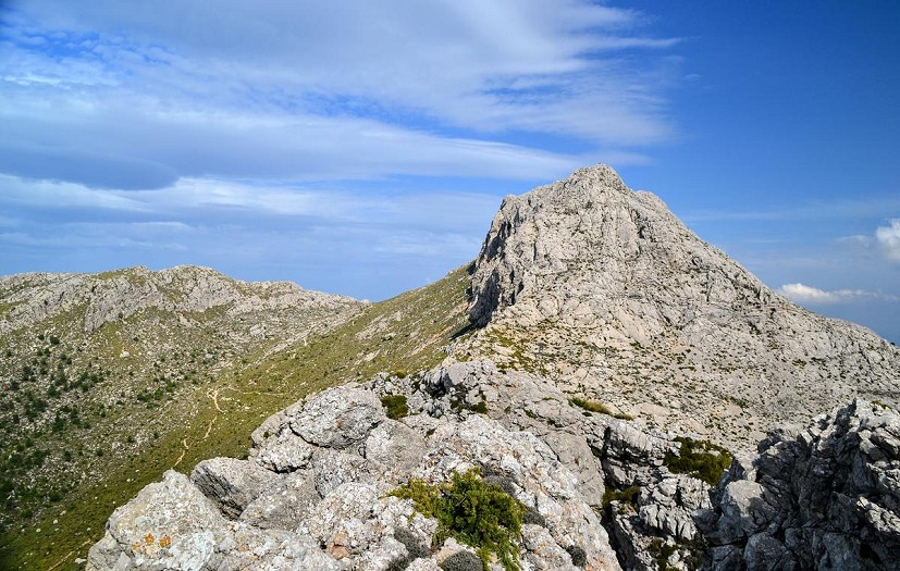 Puig de Massanella from the southwest, showing the exciting 100m scramble to the top. To the left the GR221 can be seen   © Paul Harrison