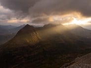 Spotlight onto a moody Liatach after a day on the Far East Wall of Coire Mhic Fhearchair