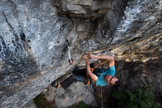 Andy Cave eyeing up the crux on a sun dappled Mecca.  © Jonathan Bean