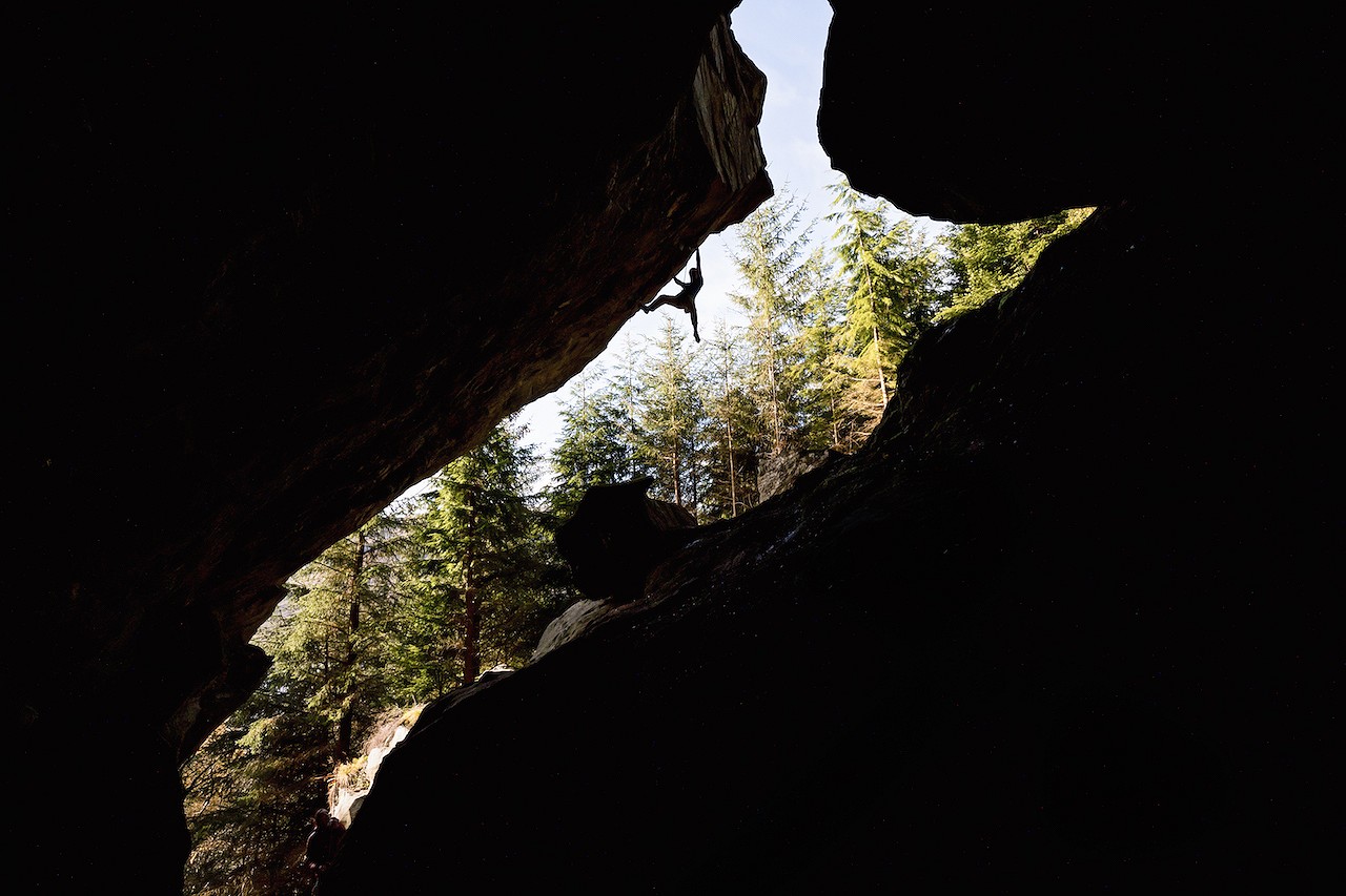 Dave MacLeod silhouetted on Hunger 9a.  © Dark Sky Media