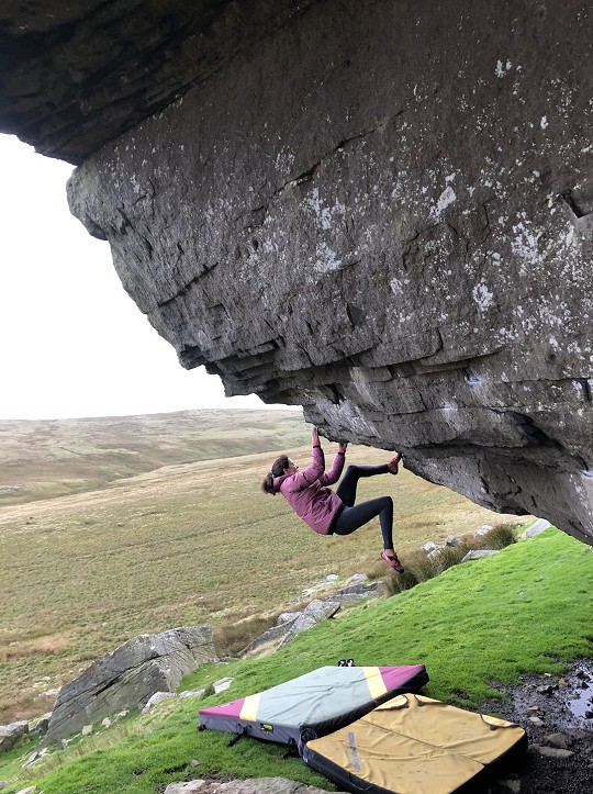 Working the toes on the steep Beth's Traverse (7B+) at Goldsborough Carr  © Andy Banks