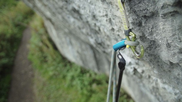 Clipping the rope into a quickdraw  © UKC Gear