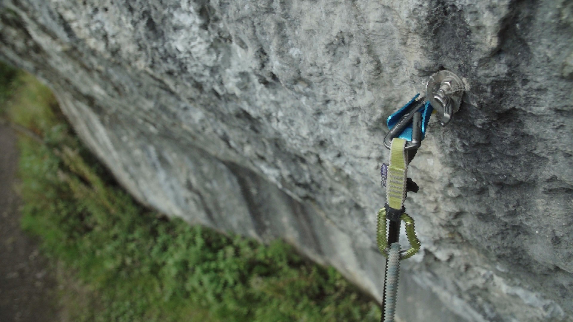 Clipping a quickdraw into a bolt  © UKC Gear