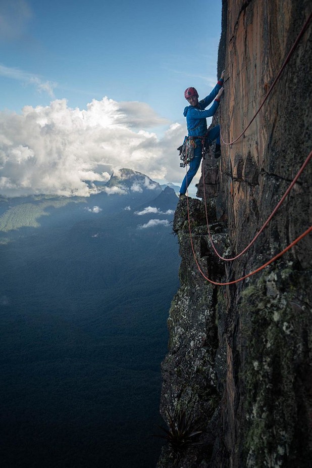 Leo heads out along pitch 5 - a long traverse above the roofs  © Coldhouse Collective