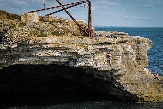 Teetering above September seas on Jess' maiden voyage into deep water soloing   © markvaughan