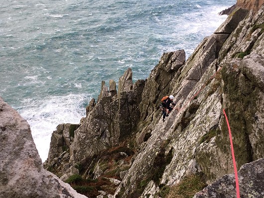 Comando Ridge at Bosigran. GEVO seconding the final pitch. 50mph winds, squaly rain, 25ft of swell. great day out!  © Donesy