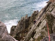 Comando Ridge at Bosigran. GEVO seconding the final pitch. 50mph winds, squaly rain, 25ft of swell. great day out!