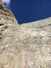 Greg on the top of the top pitch, photo shows the typical spacing of the bolts on the route