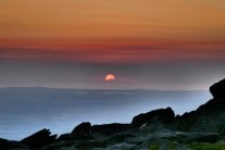 Sunset over Slieve Donard from wild camp on summit of Pen yr Ole Wen in Snowdonia