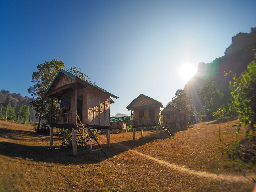 The popular bungalows at Camp 2 - just as the sun rises above the morning crags   © Tom Skelhon