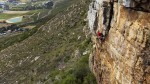 Pulling through the crux on Drop Zone at Silvermine, Cape Town