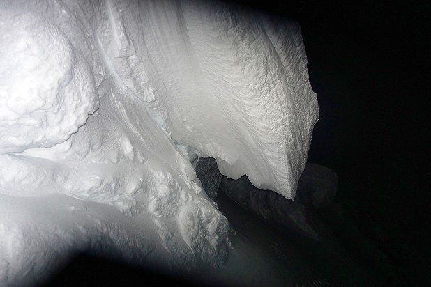 A scary cornice looms up out of the dark  © John Fleetwood