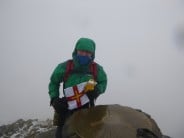 "Travelin Garfield" with me on the summit of Snowdon. Via the Watkin path, with freezing hail falling.