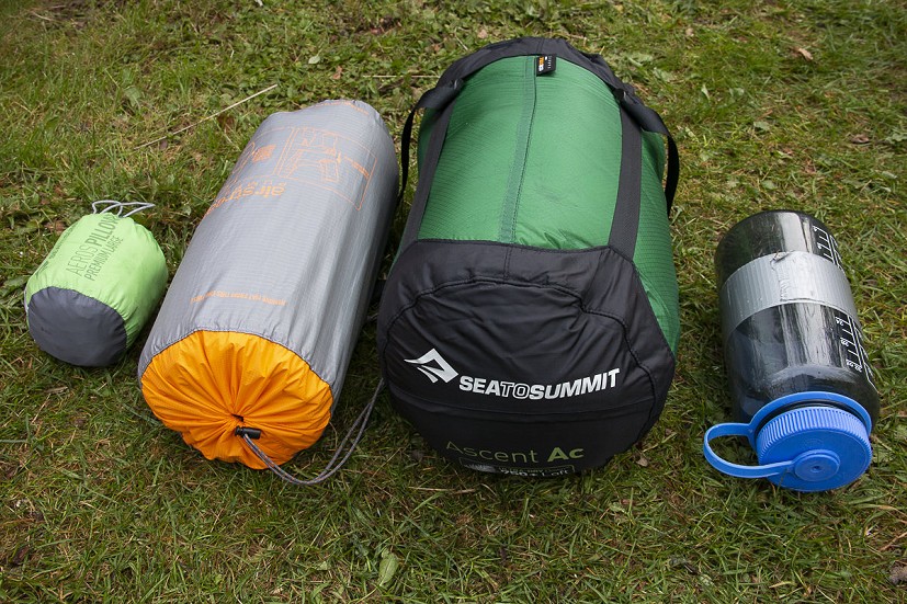 Pillow, mat and sleeping bag with a 1L bottle for scale  © Dan Bailey