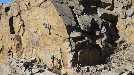 Climbing the route (guy in blue shirt)  © Cragcloud