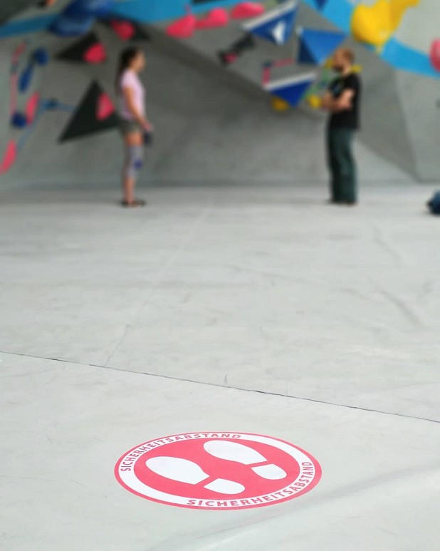 From a distance: stickers on the mats remind customers of social distancing rules.   © Boulderwelt Frankfurt