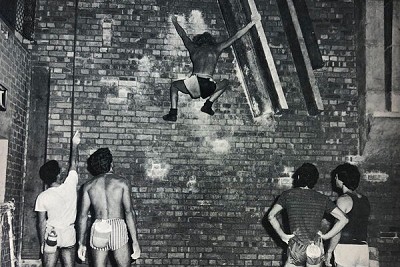 Ian 'Squawk' Dunn climbing on the Bolton Tech Wall, with L-R John Hartley, Mick Lovatt, John Monks and Jerry Peel below  © David B.A. Jones