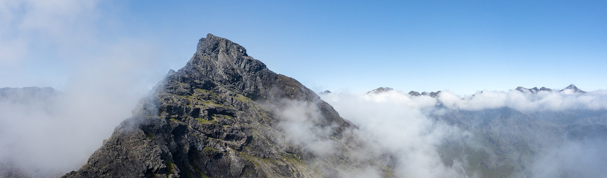 Sgurr Dubh Mor emerges from the cloud, as seen from Sgurr Dubh Beag - it's where we're heading next  © Dan Bailey