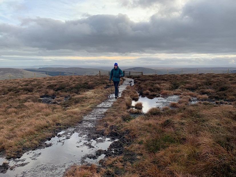 On the border ridge, flagstones have tamed some of the bogs... after a fashion  © Alan James