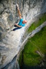 Making the final big move on An Uneasy Peace 7c+ at Malham Cove with all the exposure a person can ask for.
